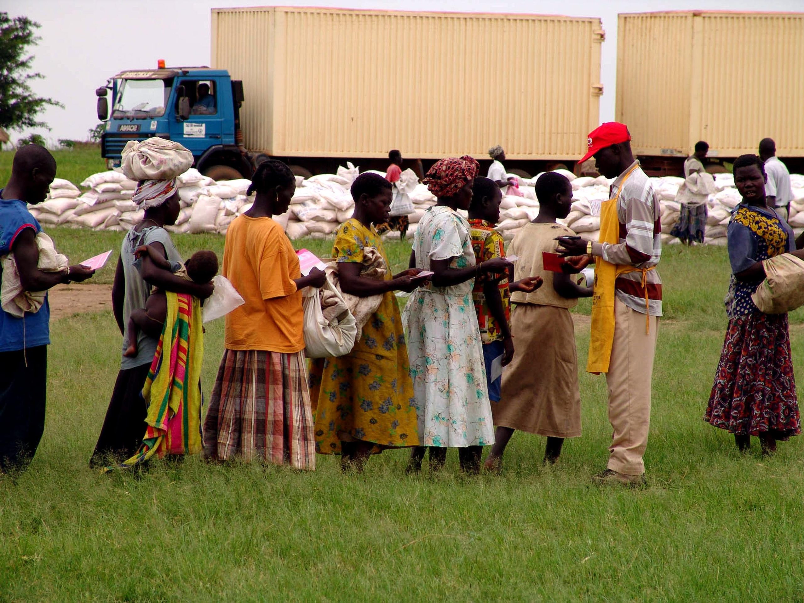 checking-forms-to-distribute-food-aid-at-a-camp-for-internally-displaced-persons.jpg